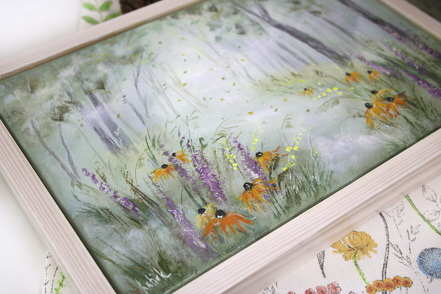 Hand-painted artwork of a misty autumn meadow with wildflowers