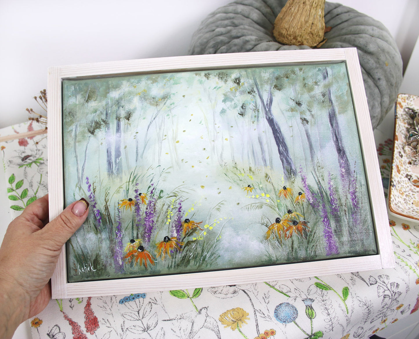 Hand-painted artwork of a misty autumn meadow with wildflowers