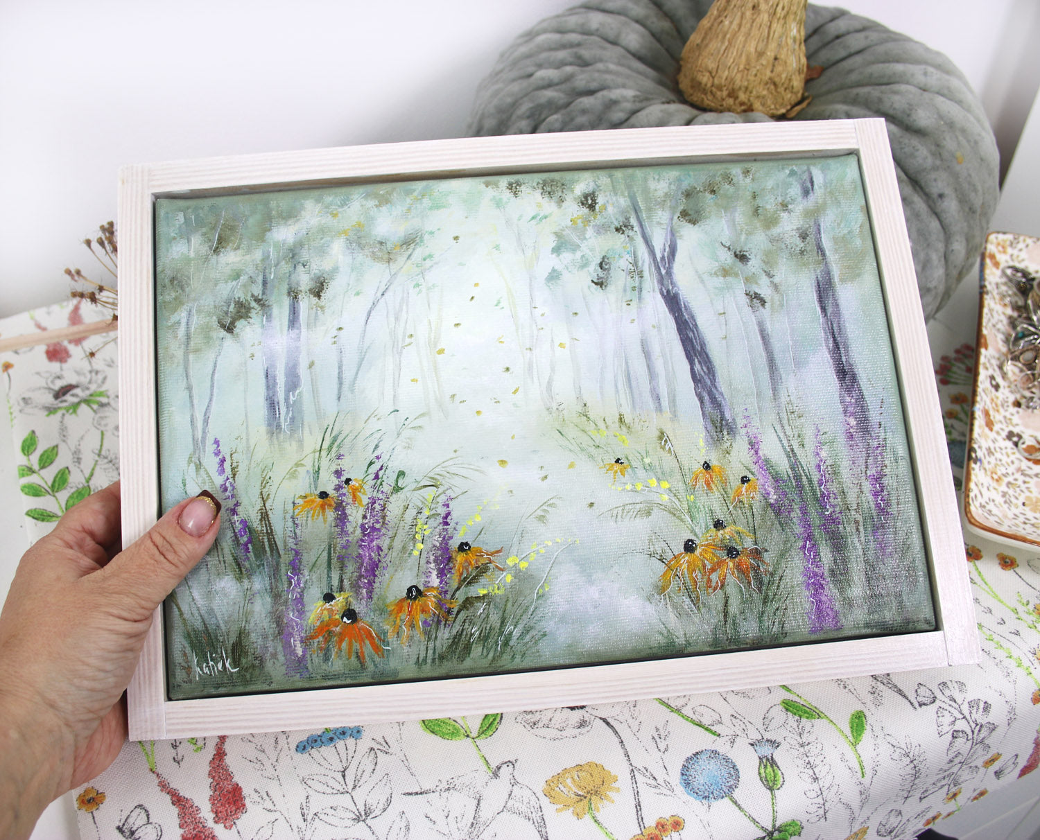 Hand-painted artwork of a misty autumn meadow with wildflowers
