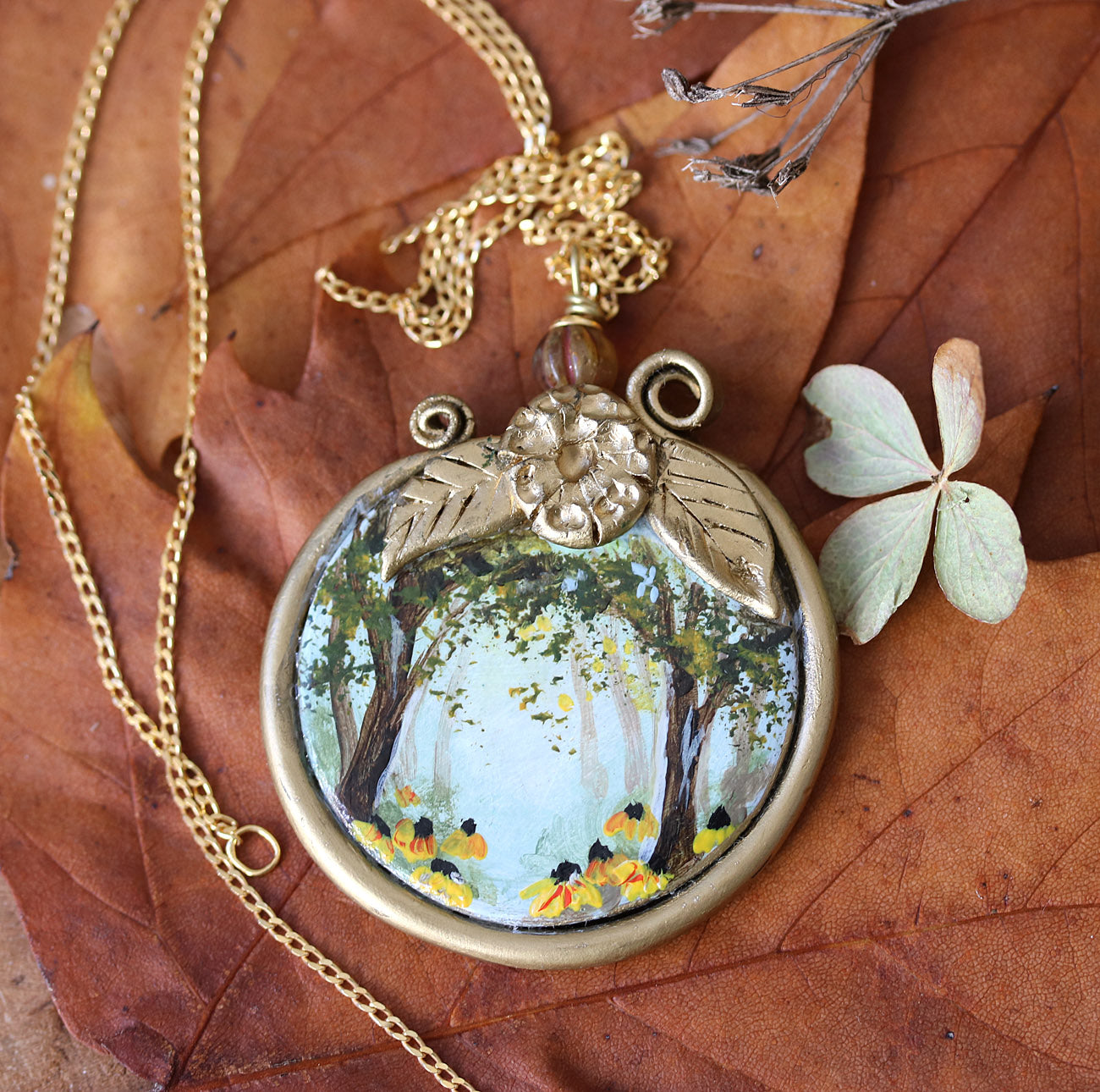 Necklace with a pendant depicting a forest scene on autumn leaves hand-painted jewelry by Katie Koroleva
