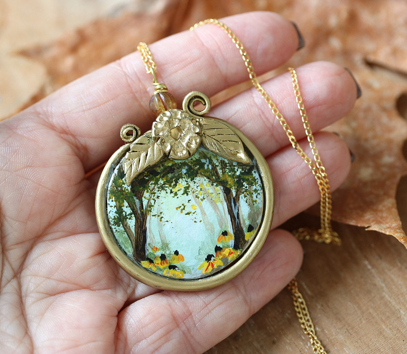 Necklace with a pendant depicting a forest scene on autumn leaves hand-painted jewelry by Katie Koroleva