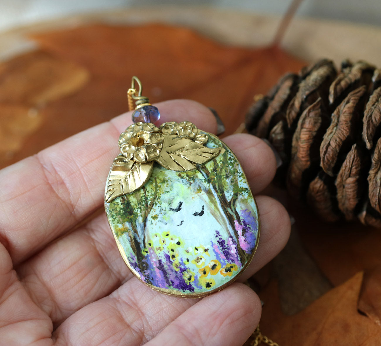 Hand painted art necklace with wild flowers blooming scene in a forest by KorolevaArt