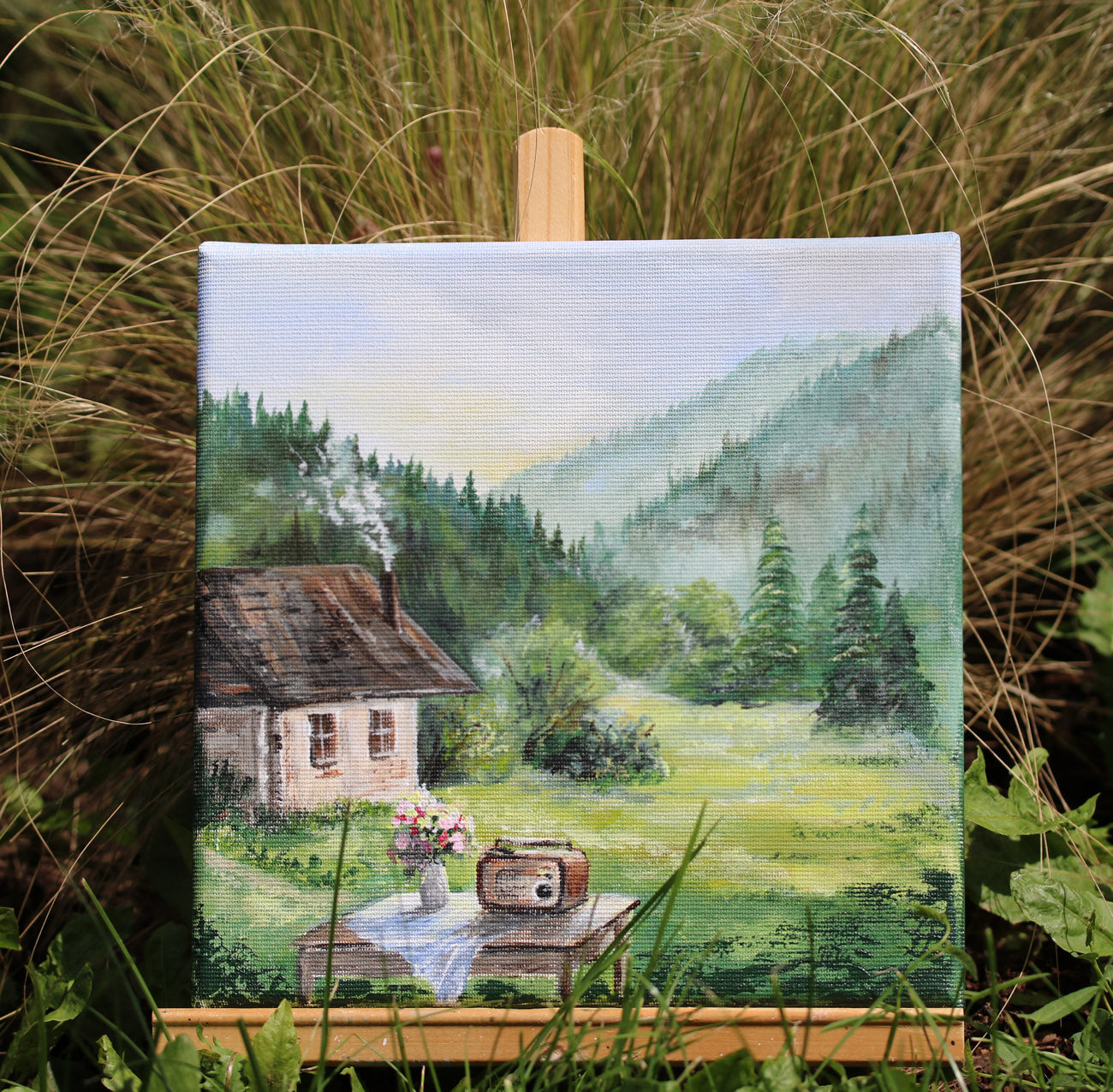Rustic cottage scene in green meadow, original artwork from Summer in the Village collection