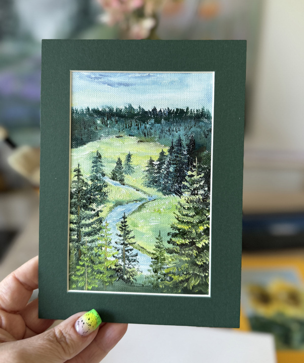 Miniature oil painting of a hillside river and pine forest, original landscape artwork by Katie Koroleva.