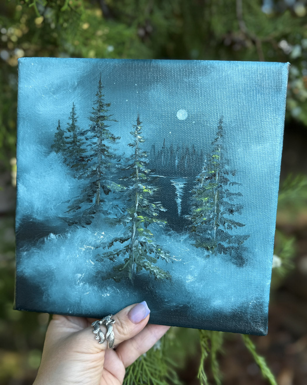 Small oil painting of moonlit forest scene