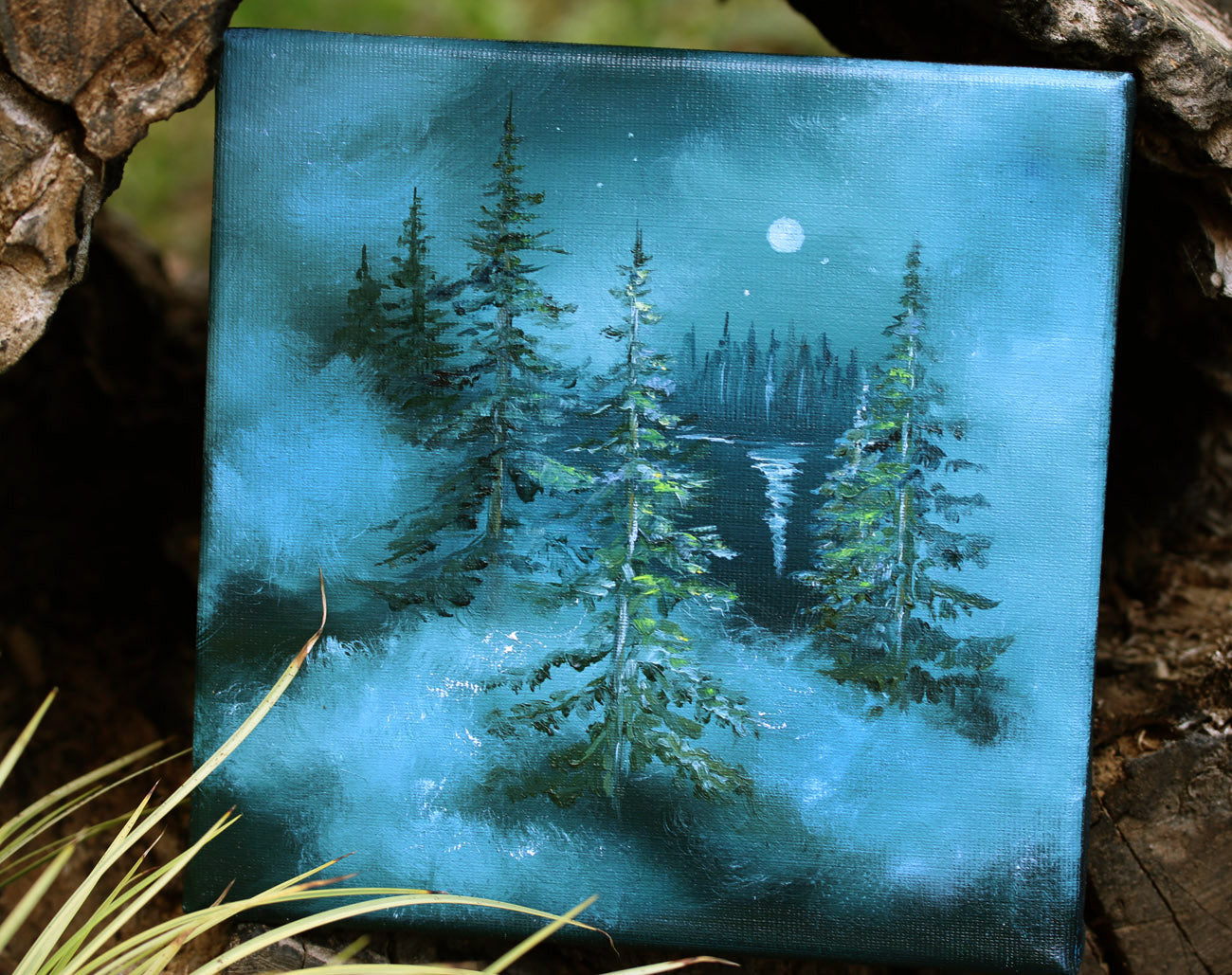 Canvas painting of a forest scene with trees and a moonlit sky