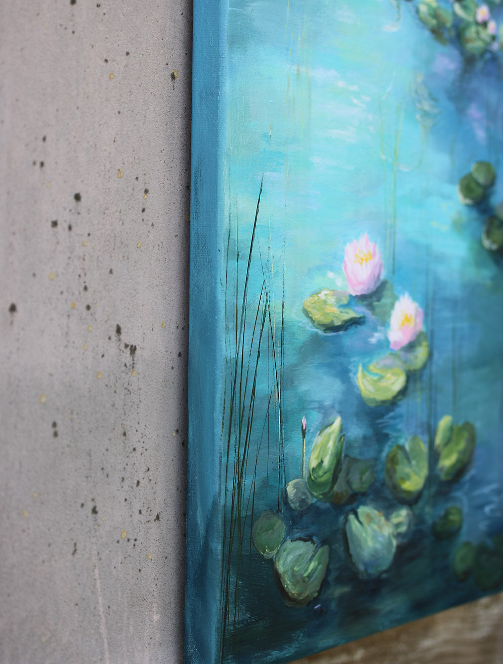Painting of water lilies on a blue pond monet style