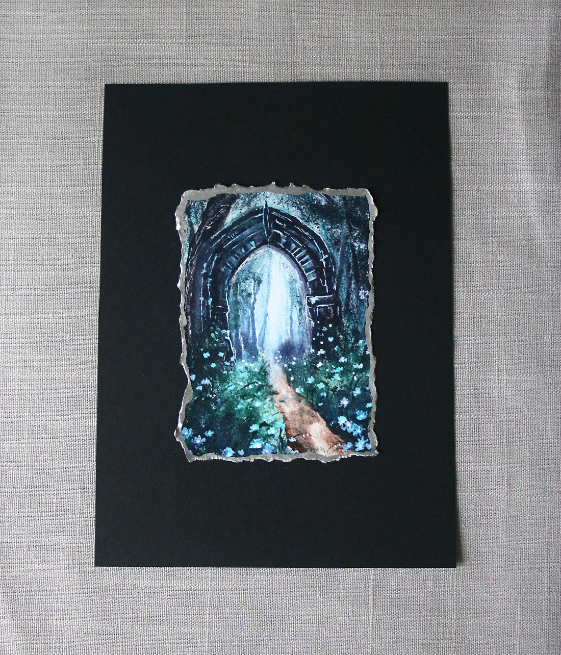 Gothic archway with a mystical landscape print