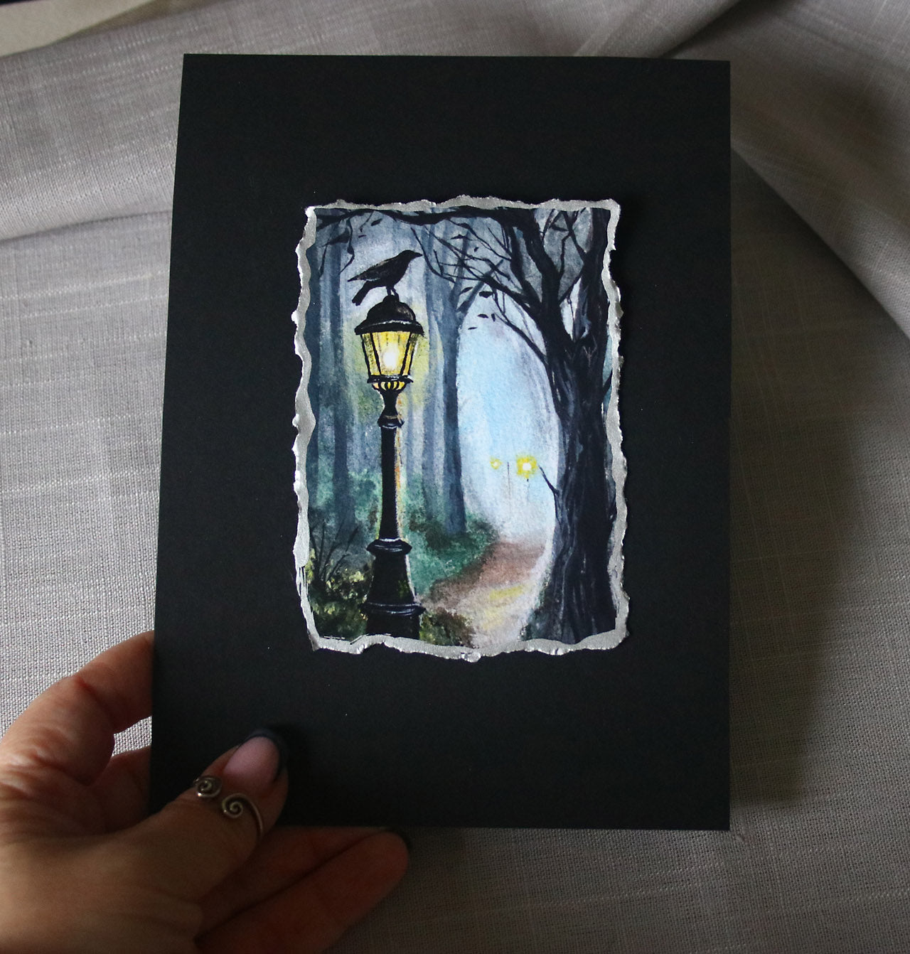 Black raven on a lantern artisan print