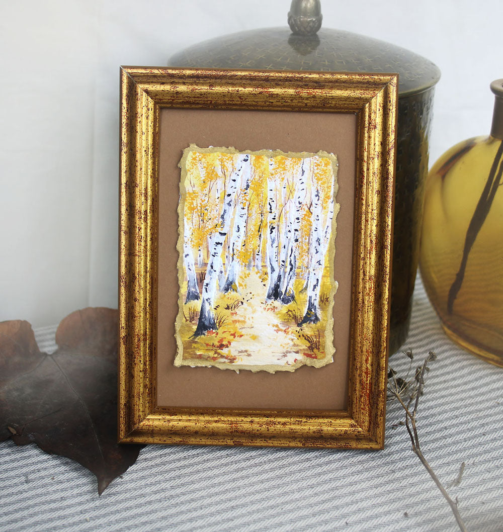 Decked edge artisan fine art print framed in golden frame depicting yellow birch trees forest
