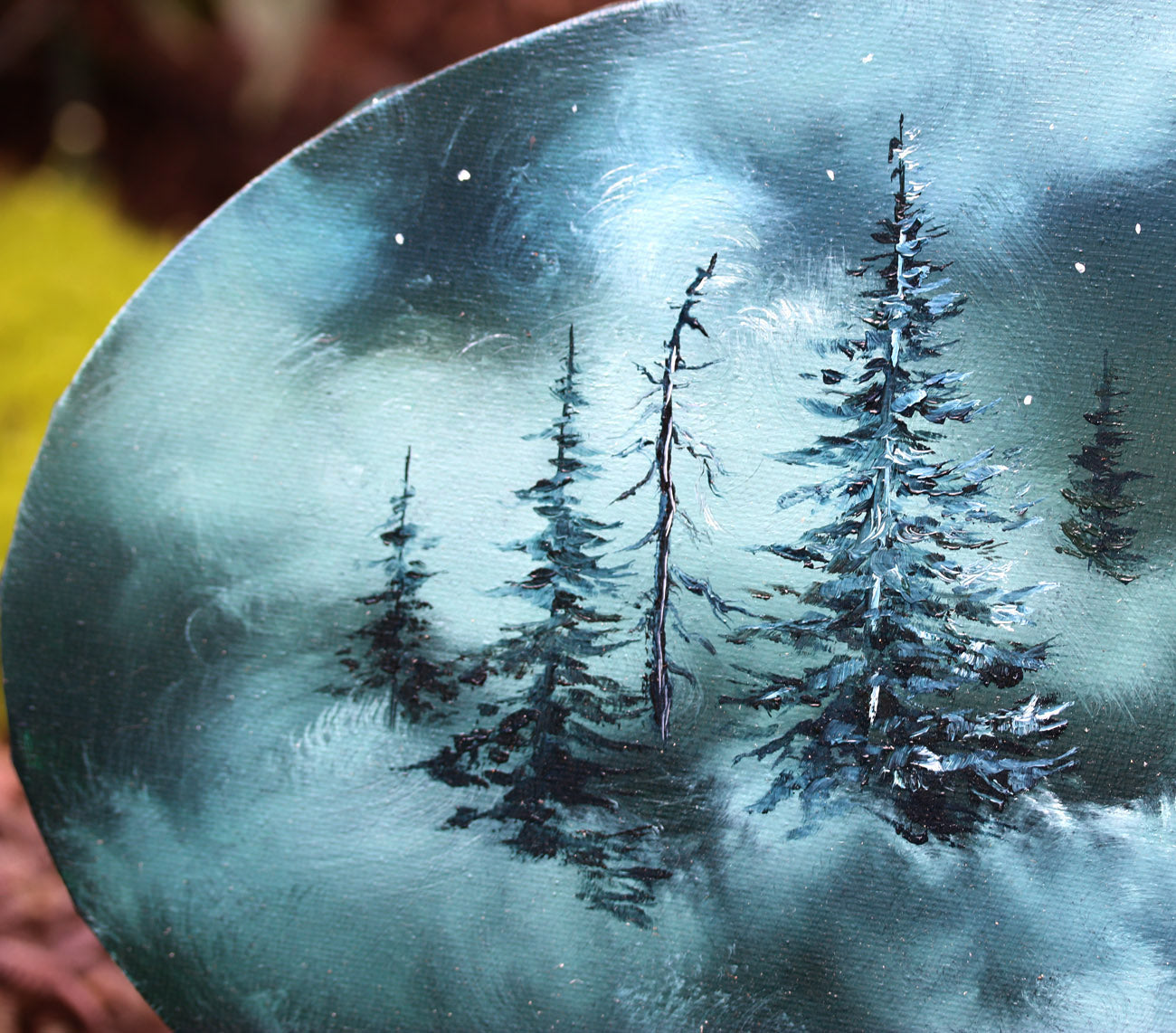 Oil painting of forest pine trees on oval canvas