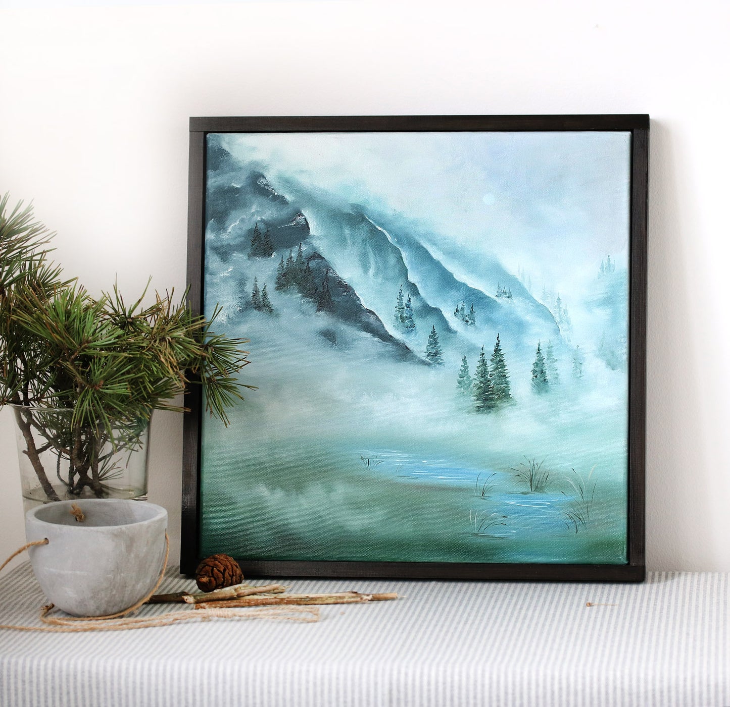 Framed oil landscape painting in cool blue green colors