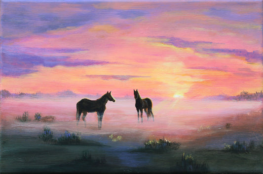A painted landscape scene showing two dark horses standing in a misty field at sunset, with a glowing orange sun and pink, purple, and blue sky.