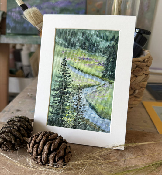 Miniature oil painting of a winding river through green meadow and pine forest, original landscape art by Katie Koroleva.