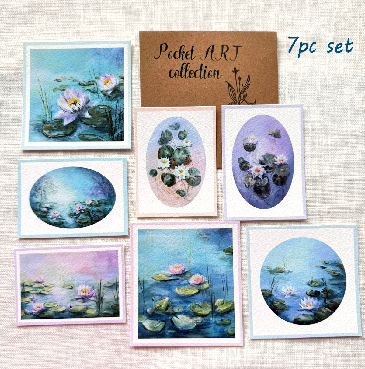 Set of 7 pocket art cards with waterlily designs on a textured surface.