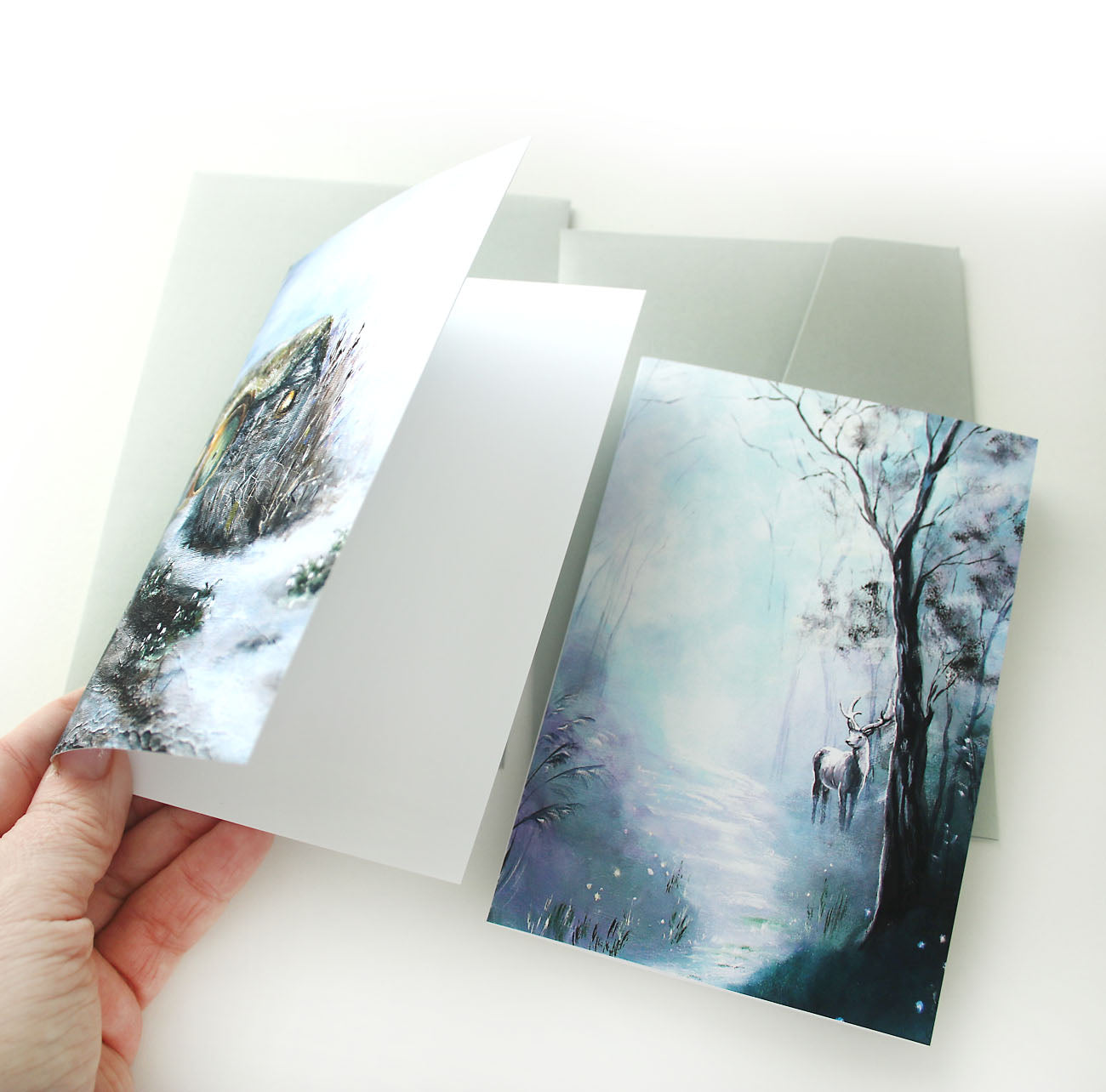 Dark forest greeting cards with hobbit cottage and deer illustrations