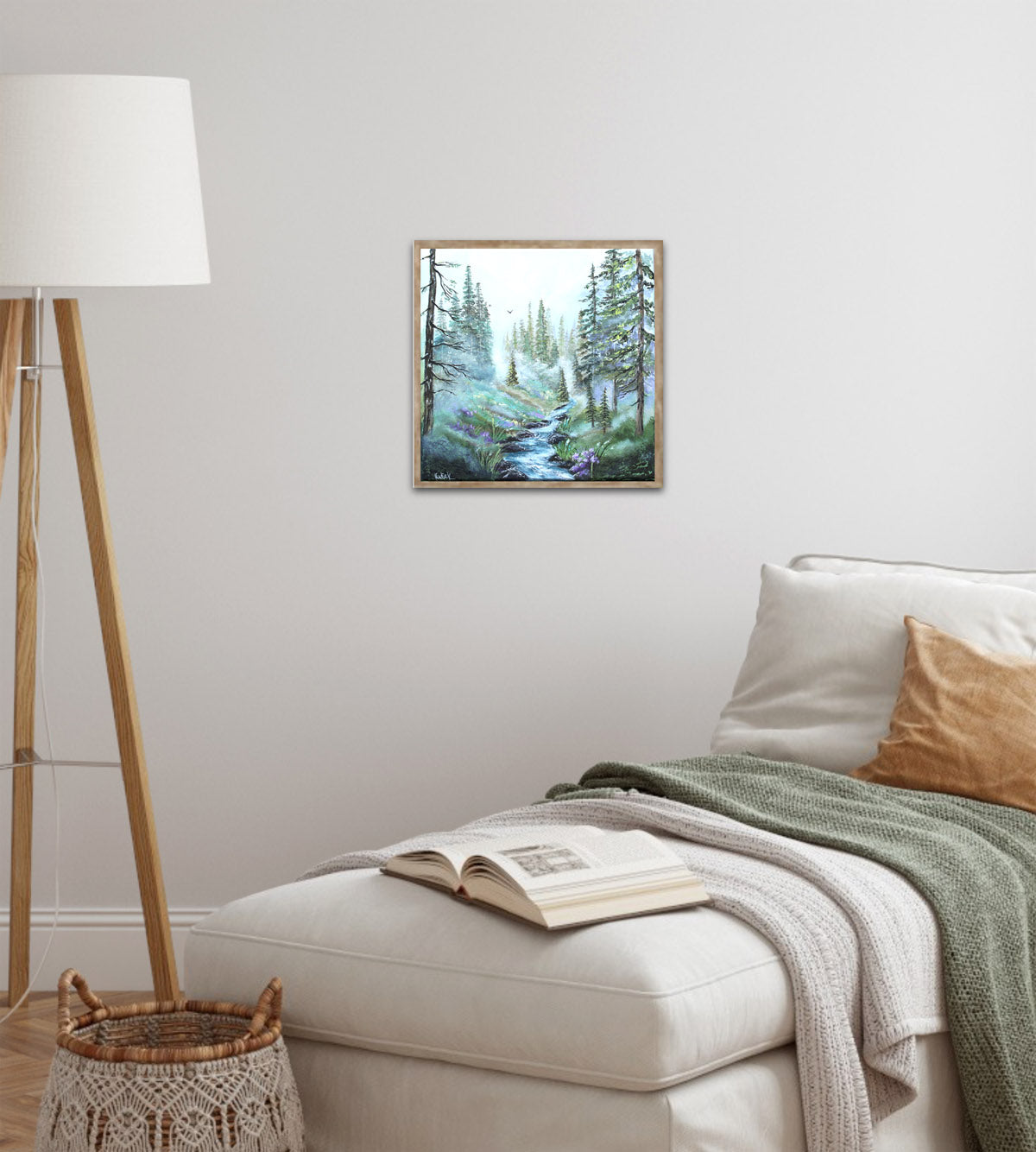 Misty morning forest stream painting displayed in a cozy Scandinavian-style reading nook.