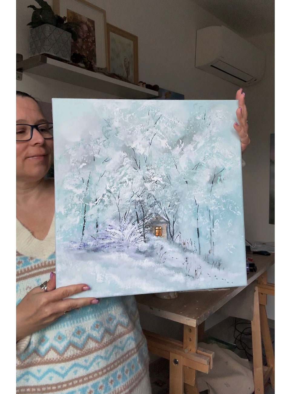 Winter landscape original painting with a small cabin hidden among snow-covered trees