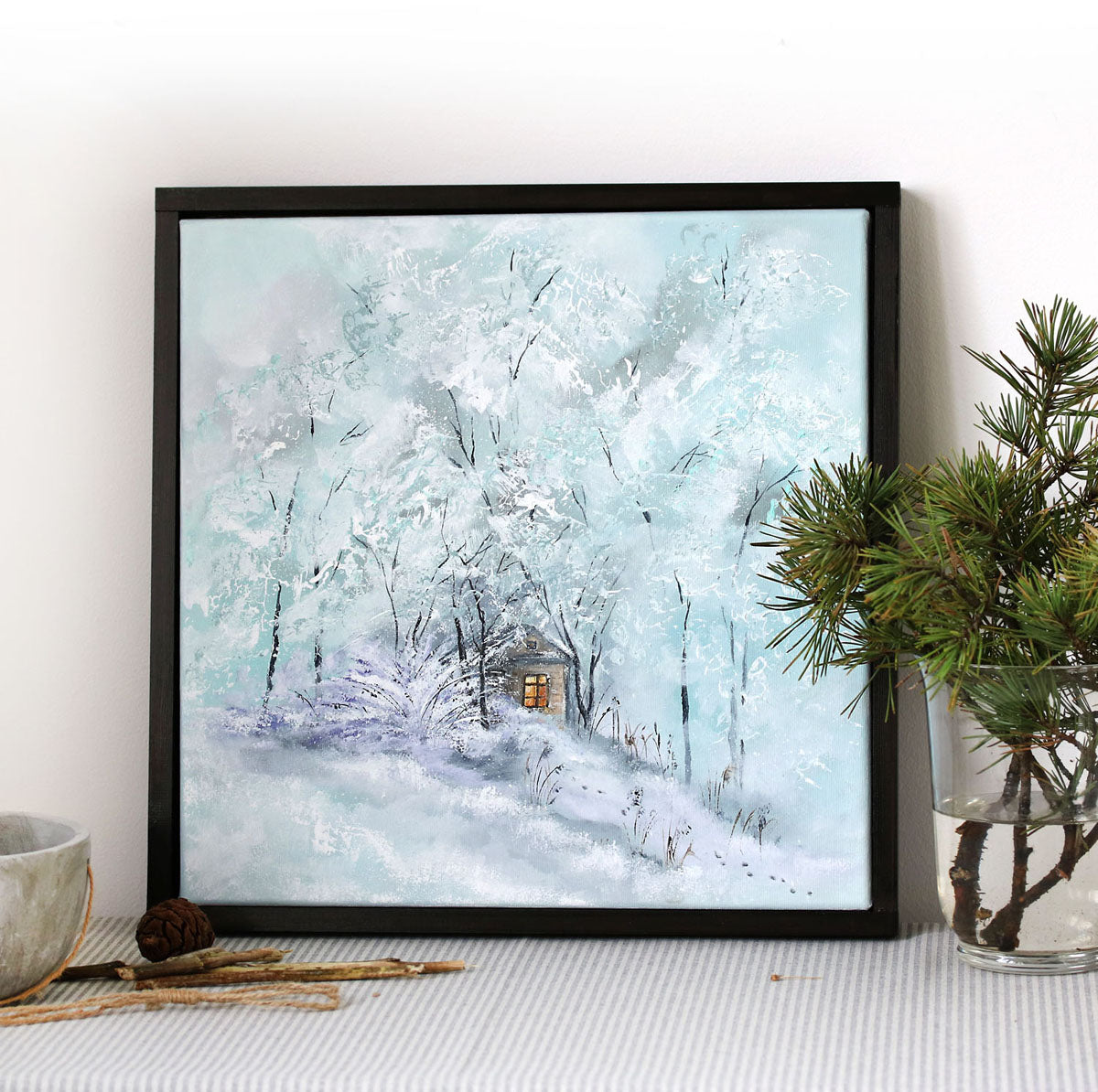 Winter landscape original framed painting with a small cabin hidden among snow-covered trees