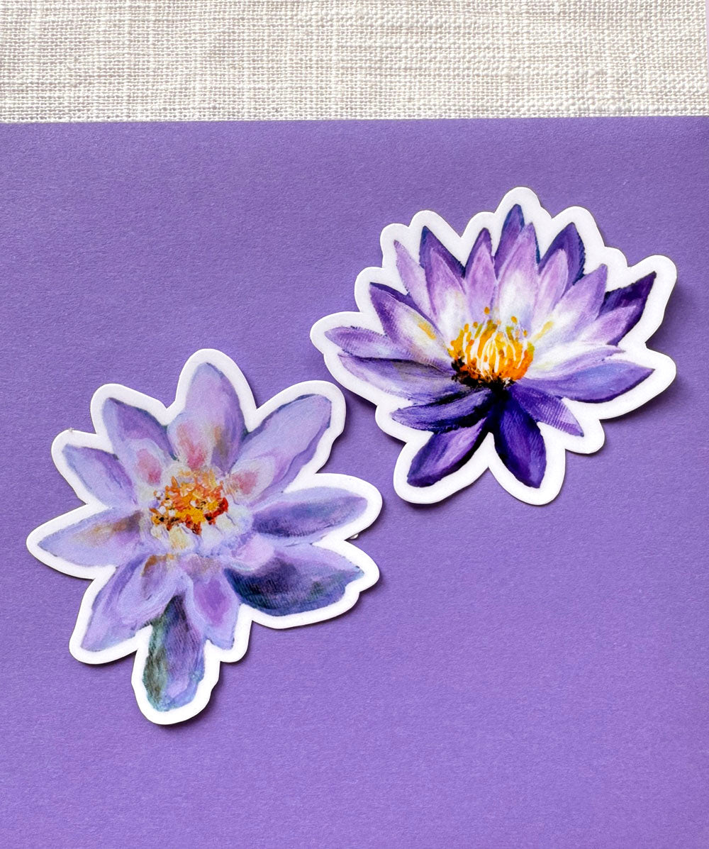 Two purple flower stickers on a purple background