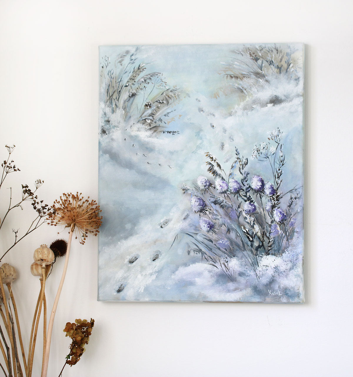 Painting of flowers and plants on a light blue background with dried plants on the left.